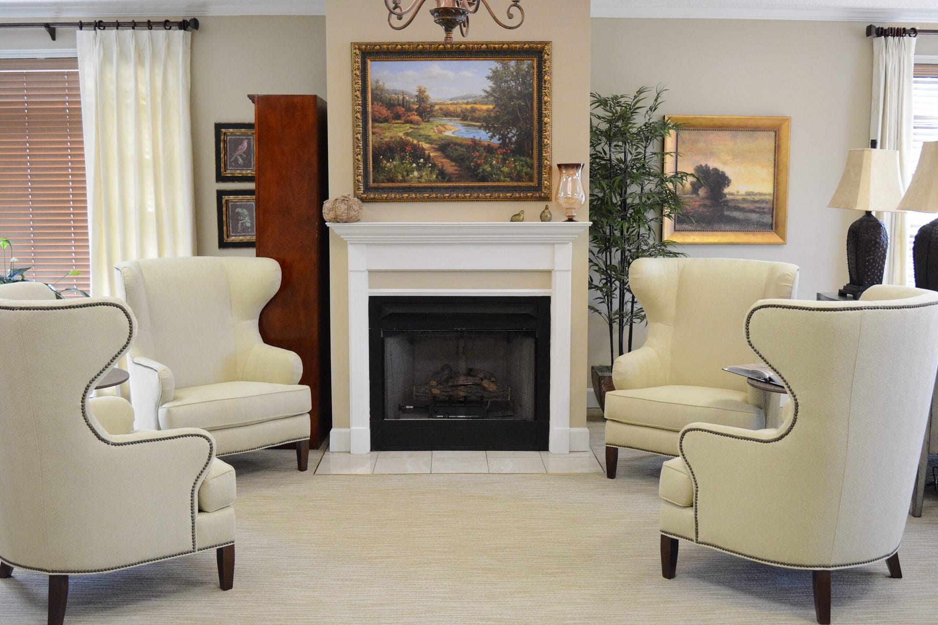 tuscaloosa living area with chairs surrounding a fireplace