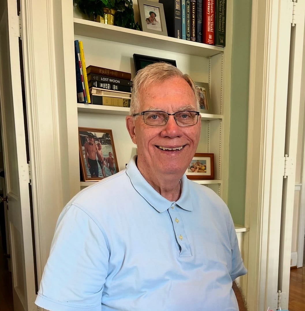 photo of Paul Smiley by the bookshelves