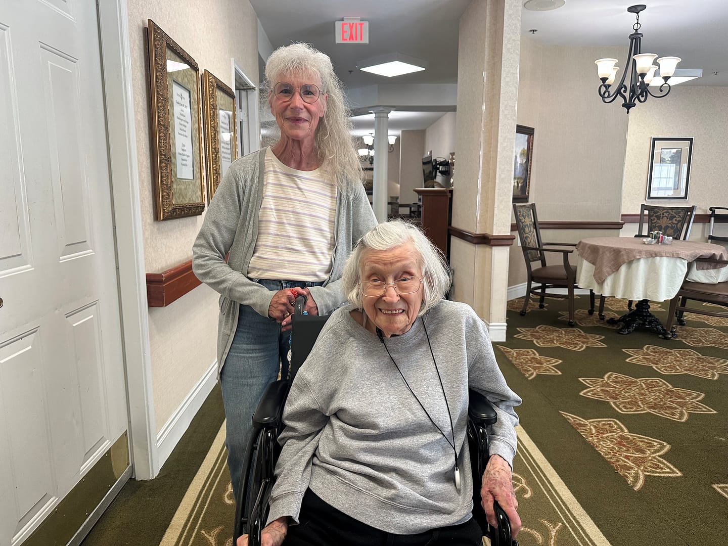 photo of Pat Eley (left) and BJ Tiller in the hallway at Morning Pointe of Tullahoma