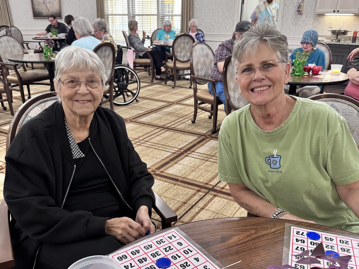 photo of resident and daughter playing bingo
