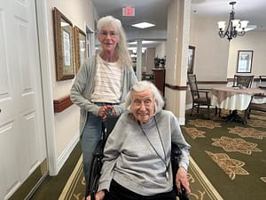 photo of Pat Eley (left) and BJ Tiller in the hallway at Morning Pointe of Tullahoma