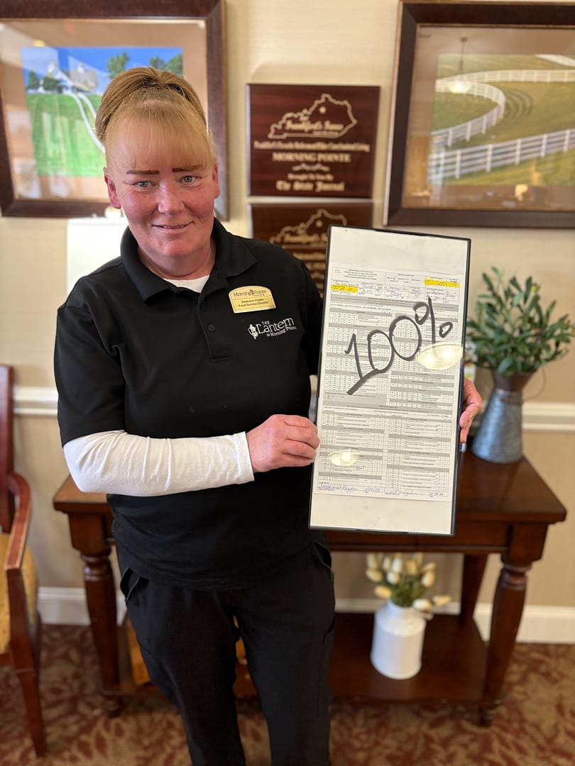 photo of Stephanie Peyton with the 2025 kitchen survey results