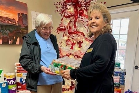 photo of resident Joan Coffey with Maxine Wilson, receptionist