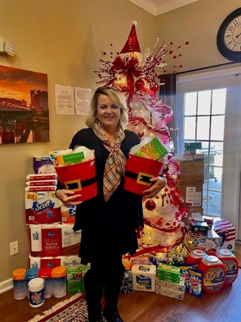 photo of volunteer delivering donations