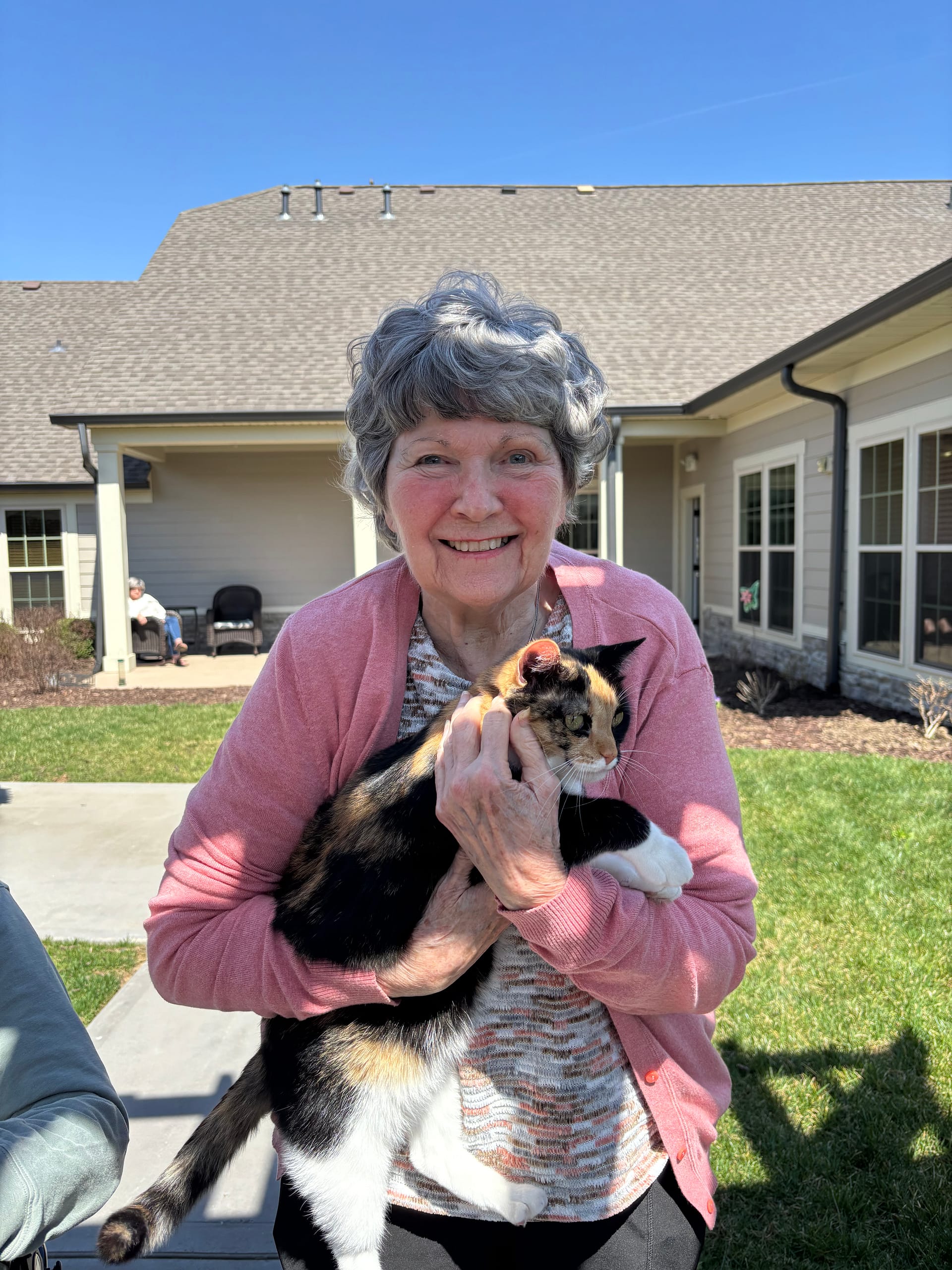 photo of resident with kitten