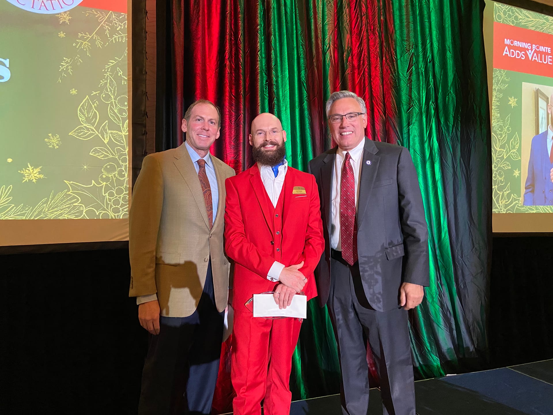 Photo, left to right: Franklin Farrow, Morning Pointe Senior Living Co-Founder and CEO; Josh Rhodes, Morning Pointe's Director of Information Technology and Exceeding Expectations winner for the Home Office; and Greg A. Vital, Morning Pointe Co-Founder and President