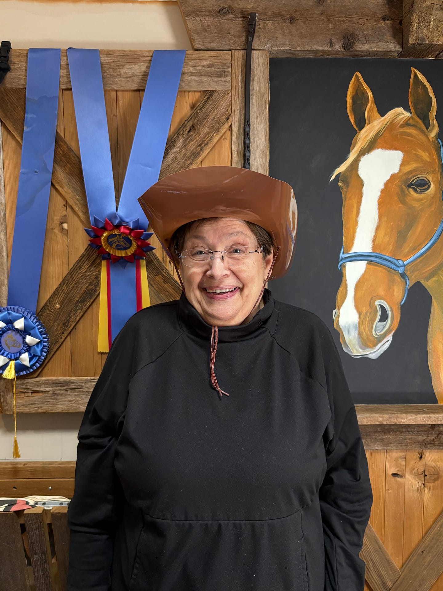 photo of memory care resident smiling with cowboy hat