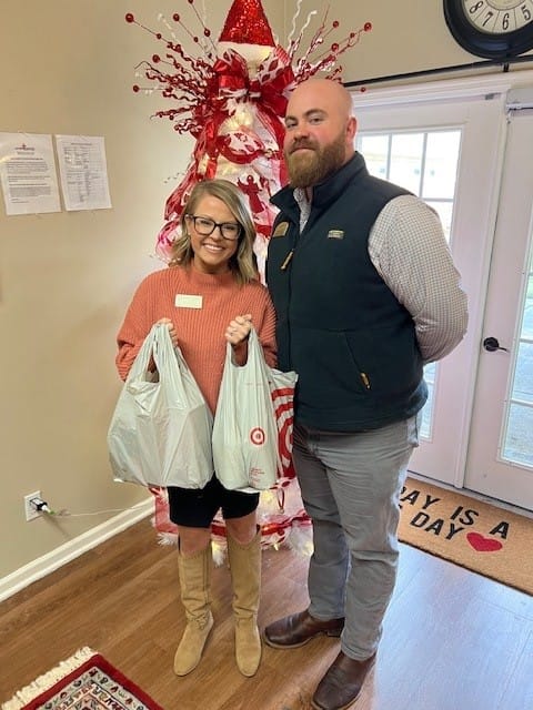 photo of Lones Green, Community Relations Director, accepting donations