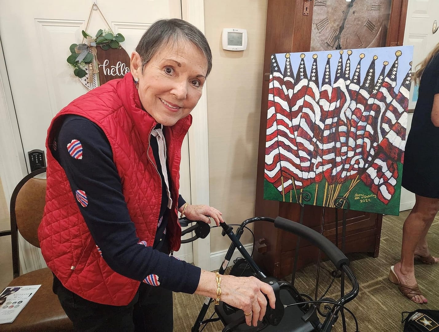 Photo of Morning Pointe of Hixson resident Sherry Dahrling with her acrylic painting, Old Glory