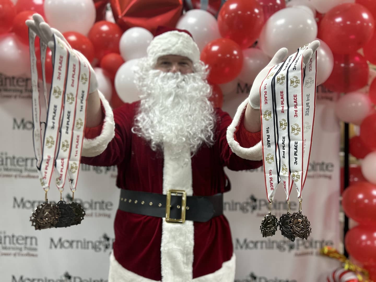 Santa Shuffle 5K medals with Santa