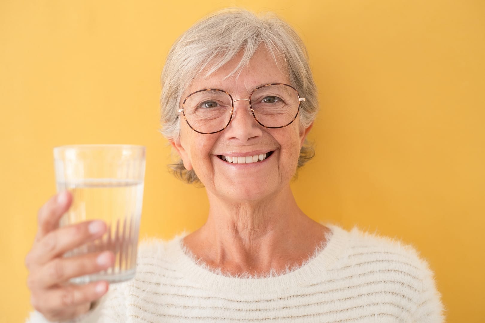 photo of senior woman with water