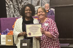 photo of Bardella Hall receiving the Caring Hearts Award