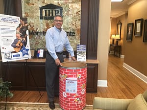 photo of Greg Vital with the Stock Their Lockers barrel