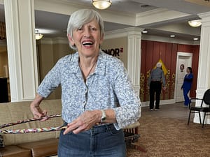 photo of happy Lantern resident hula hooping