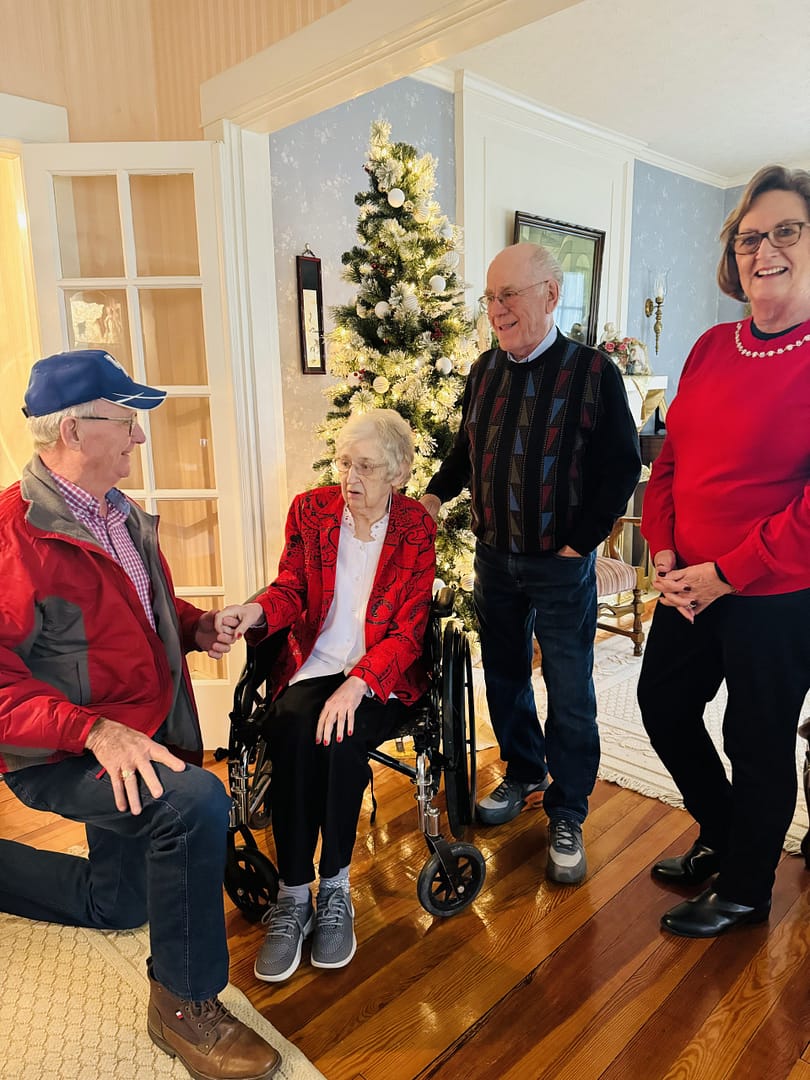 photo of Linda and Bert visiting with guests