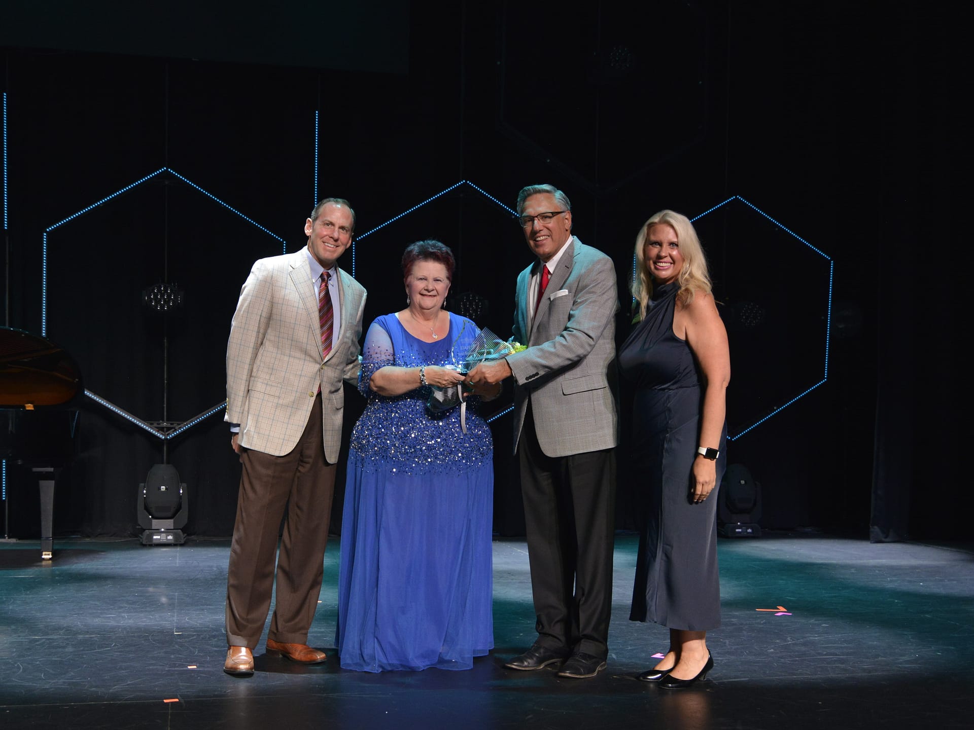 Left to right: Franklin Farrow, Morning Pointe Senior Living Co-Founder and CEO; Crystal Little, 3rd Place Winner; Greg A. Vital, Morning Pointe Senior Living Co-Founder and President; and Miranda Perez, Morning Pointe Foundation Executive Director