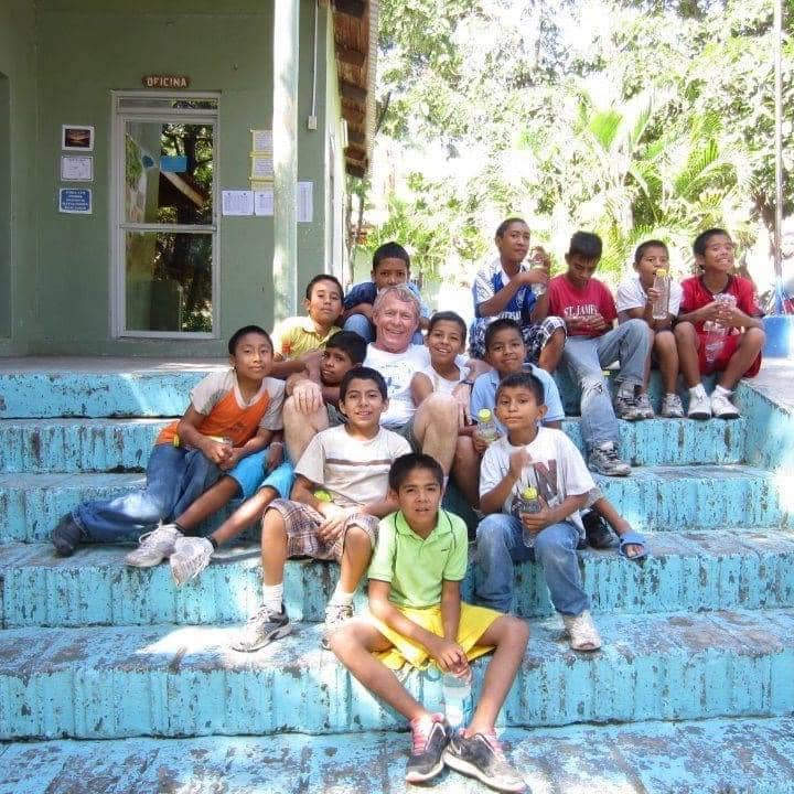 Bob with children in Honduras