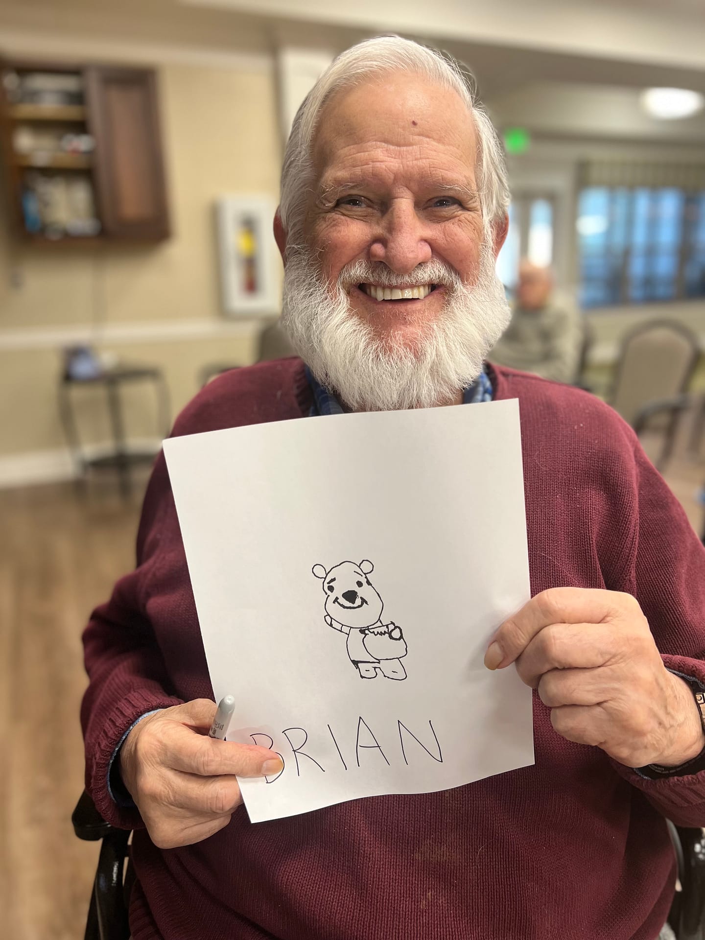 photo of Brian with his Winnie-the-Pooh drawing at Morning Pointe of Chattanooga