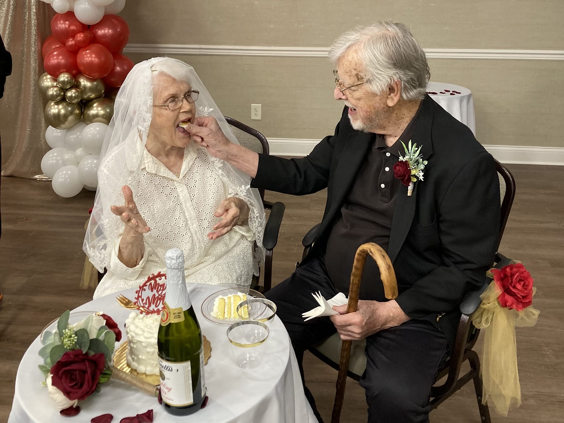 photo of Jim and Cynthia Marcotte sharing cake