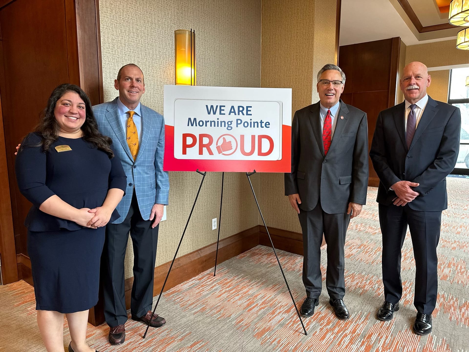 photo of (left to right): Lauren Lee, Senior Vice President of Accounting and Analytics; Franklin Farrow, Morning Pointe Co-Founder and CEO; Admiral Scott Swift; and Greg A. Vital, Morning Pointe Co-Founder and President