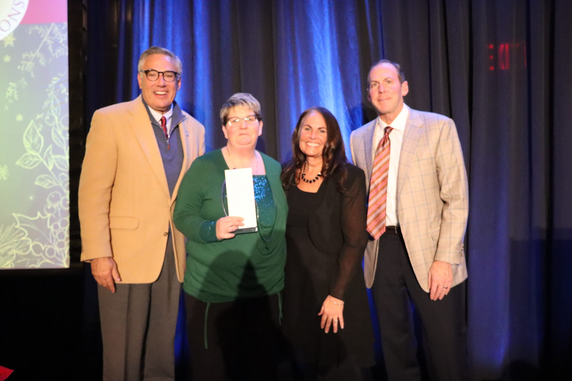 photo, Left to right: Greg A. Vital, Morning Pointe Senior Living co-founder and president; Valerie McCoy, certified nursing assistant at Morning Pointe of Franklin, TN; Sheryl Klein, VP of Morning Pointe Senior Living's Cumberland Region; and Franklin Farrow, Morning Pointe Senior Living co-founder and CEO