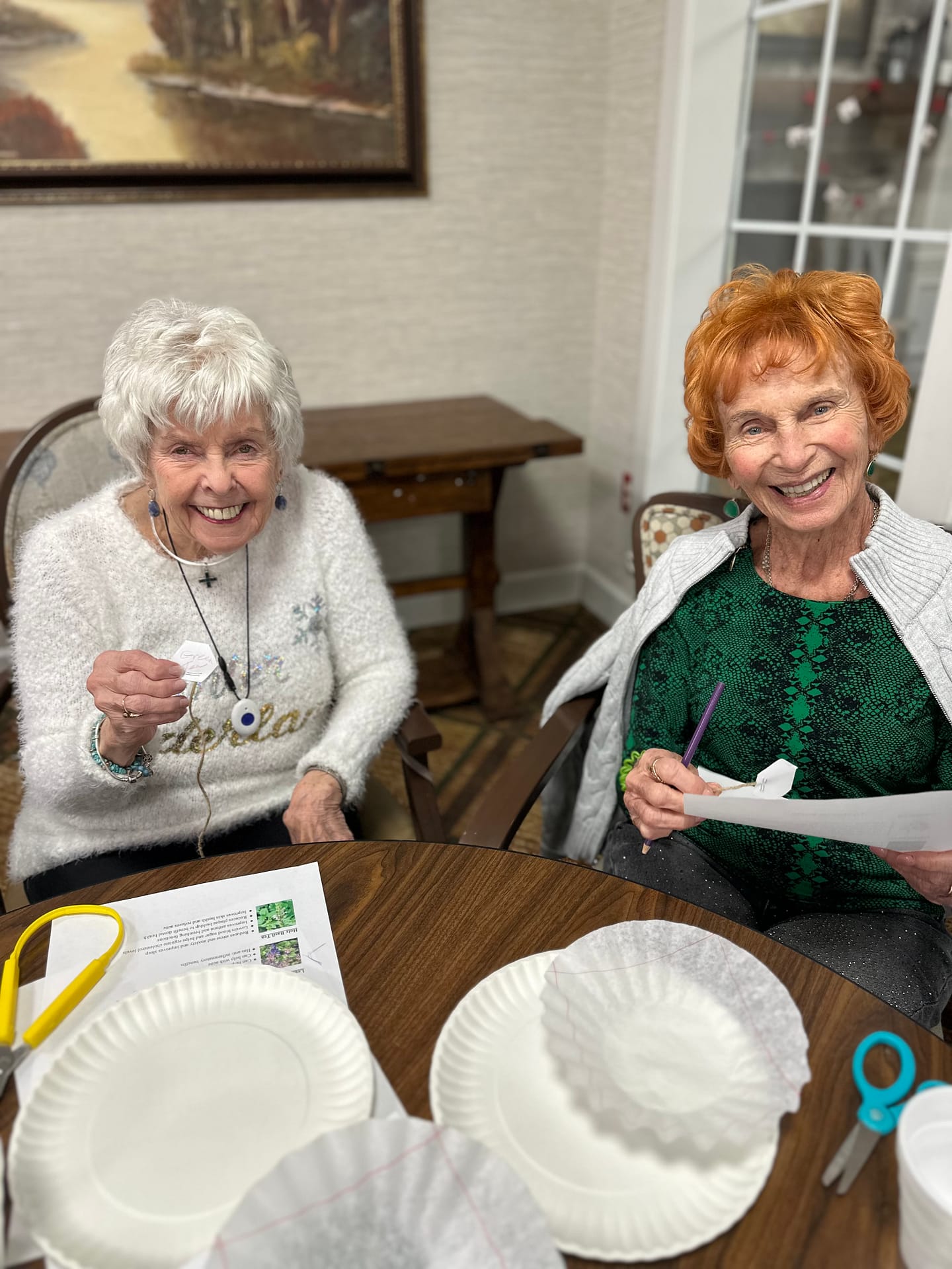 photo of Sheila working on a craft with one of her friends