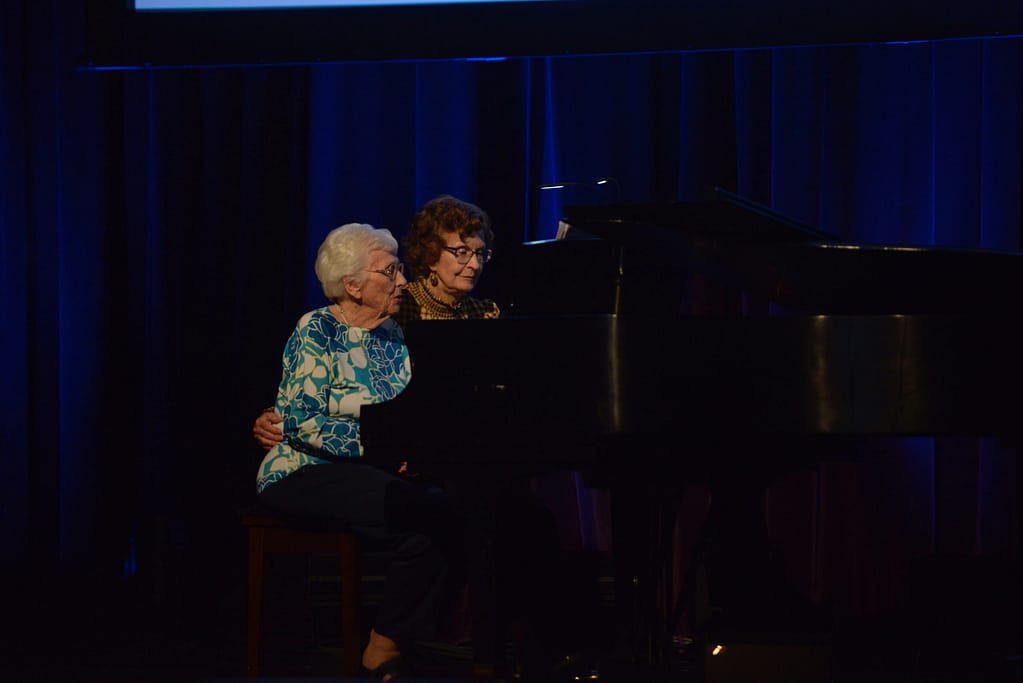 photo of Marjorie Suber, 101, and Creely Wilson, 90, performing a duet