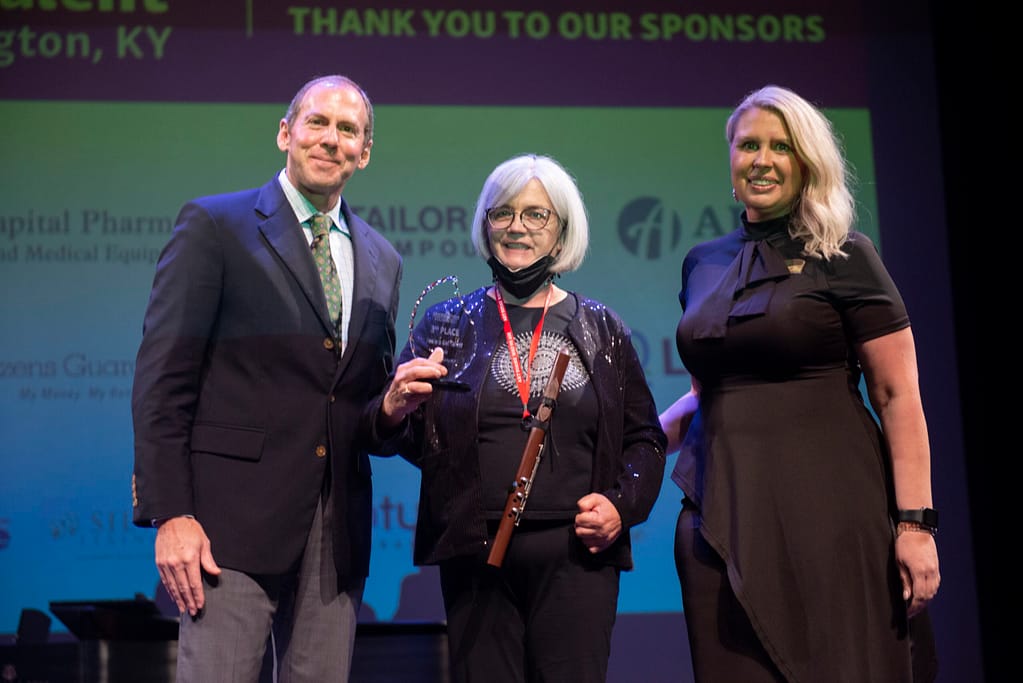 photo of Franklin Farrow, Morning Pointe Co-Founder and CEO; Lydia DiMartino-Ellis, third-place winner; and Miranda Perez, Morning Pointe Foundation Executive Director