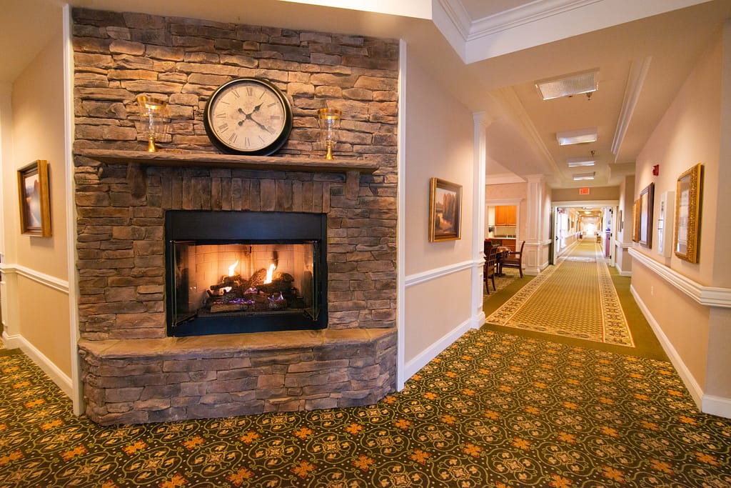 lenoir city campus hallway with fireplace and mantle