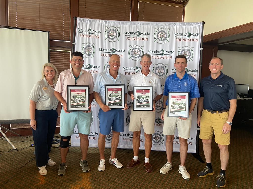 Second-place winners, Team Miller & Martin, with players (four in the center) Hugh Sharber, Scott Parrish, Merrill Nelson and Evan Sharber. Left is Miranda Perez, Morning Pointe Foundation Executive Director, and right is Franklin Farrow, Morning Pointe Senior Living Co-Founder and CEO