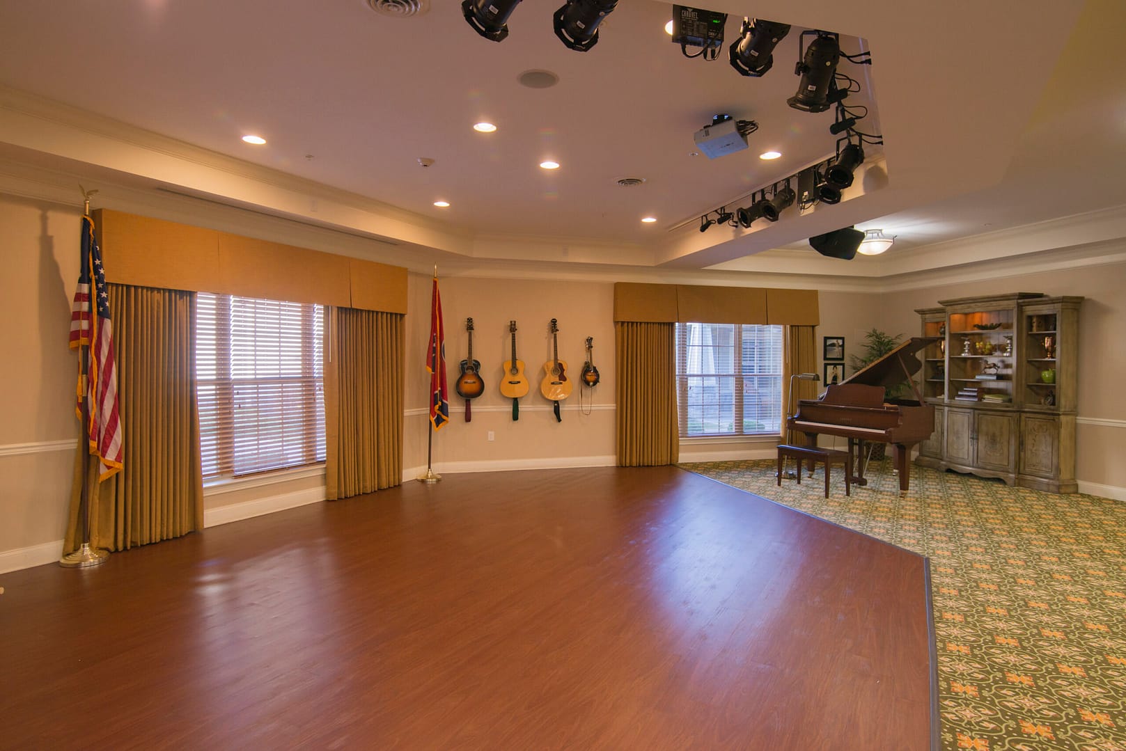 Brentwood campus activity room with musical instruments and a stage