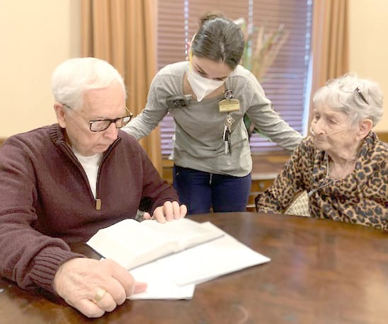 Dalton, his wife Barbara and a Morning Pointe Associate having a Bible study