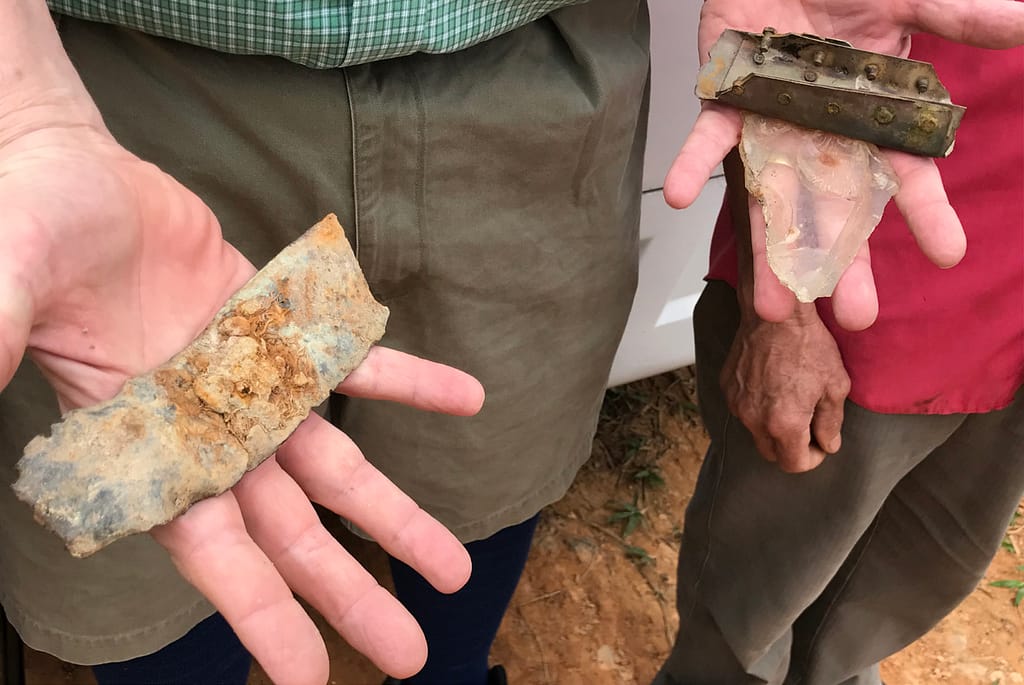 Mr. Gauntt holding a piece of war wreckage in his hand.