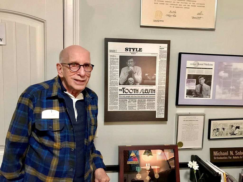 photo of Michael Sobel with some of his memorabilia 