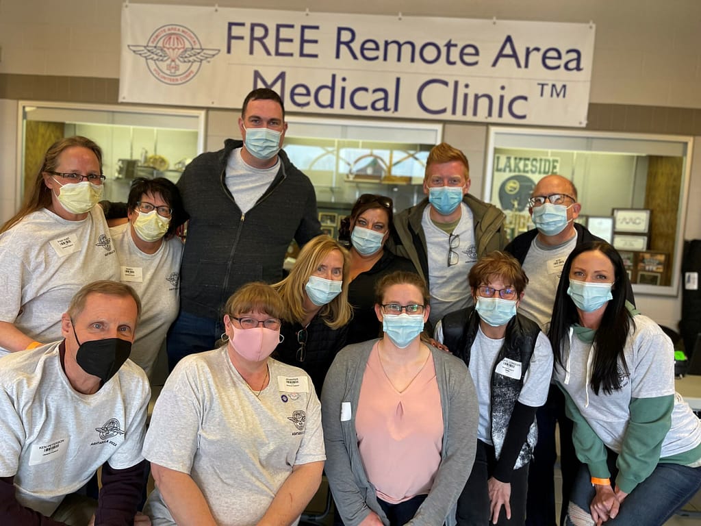 photo of Robin Jackson (back center) at one of the RAM clinics