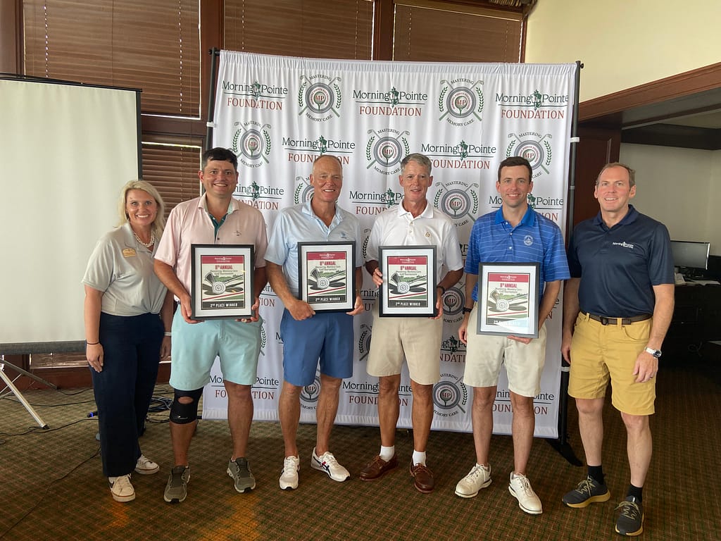 Second-place winners, Team Miller & Martin, with players   (four in the center) Hugh Sharber, Scott Parrish, Merrill Nelson and Evan Sharber. Left is Miranda Perez, Morning Pointe Foundation Executive Director, and right is Franklin Farrow, Morning Pointe Senior Living Co-Founder and CEO