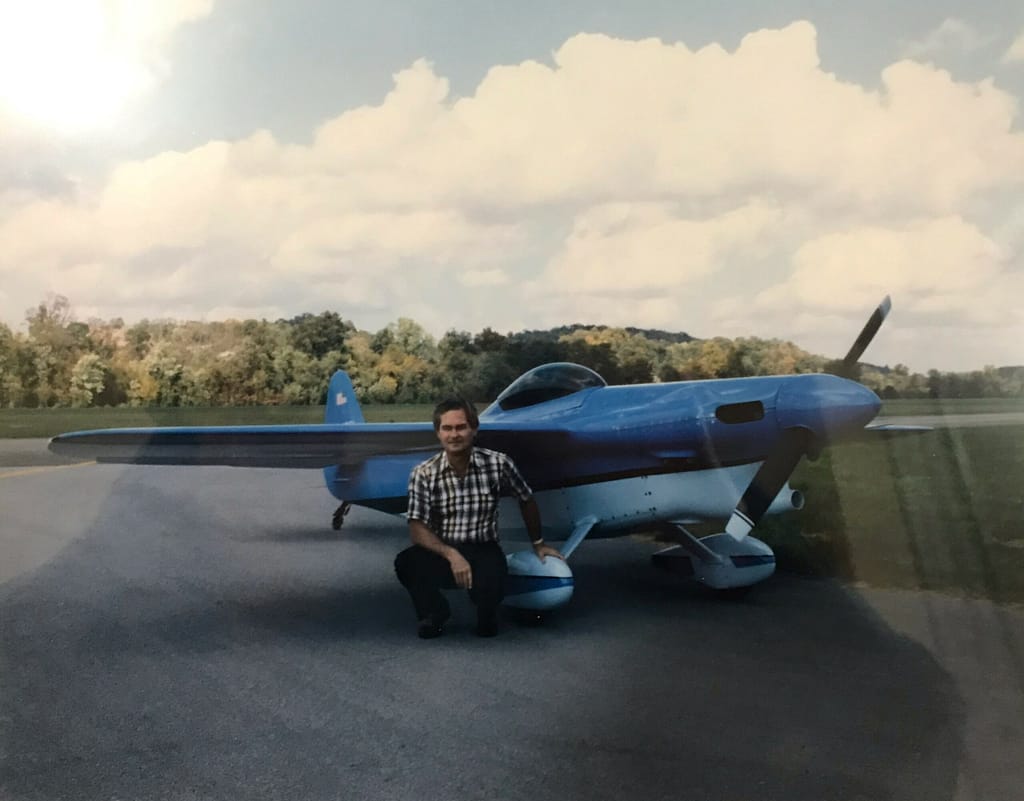 photo of Charles with one of the aircraft he built