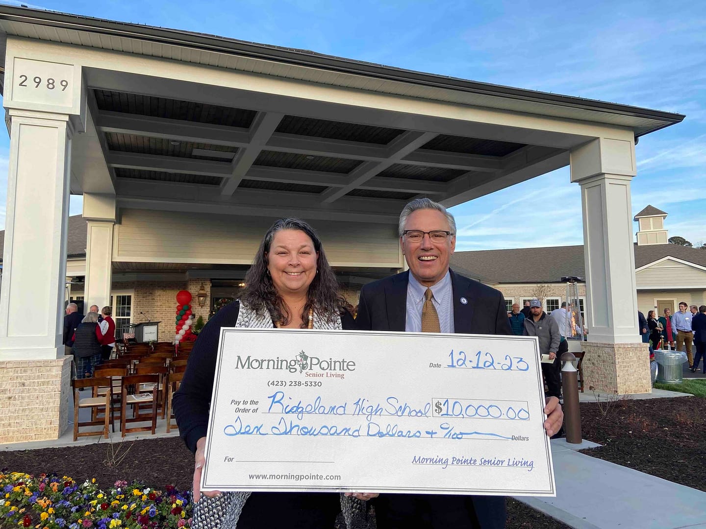 photo of Greg A. Vital presenting the check to Karen Hughes, Principal at Ridgeland High School