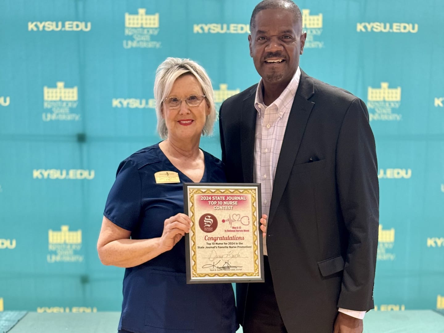 photo of Drema Banta, LPN, with newspaper publisher Kevin Austin