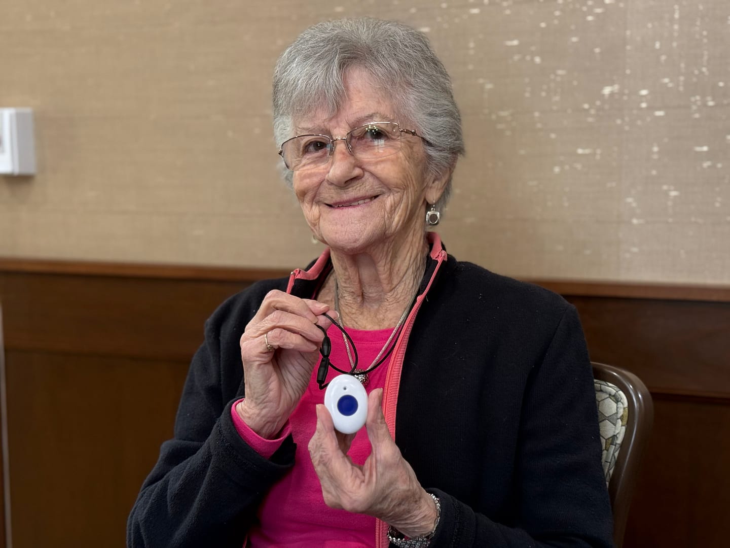 photo of MP Chattanooga resident with one of the call button necklaces