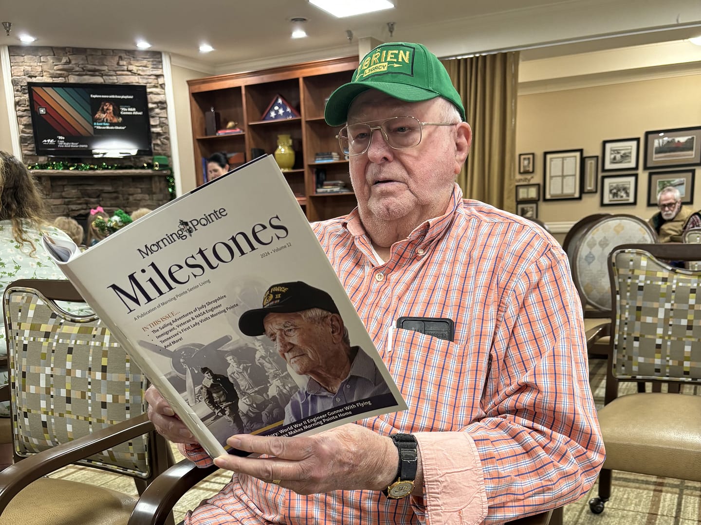 photo of Morning Pointe of Hixson resident Joel O'Brien reading Milestones 2024