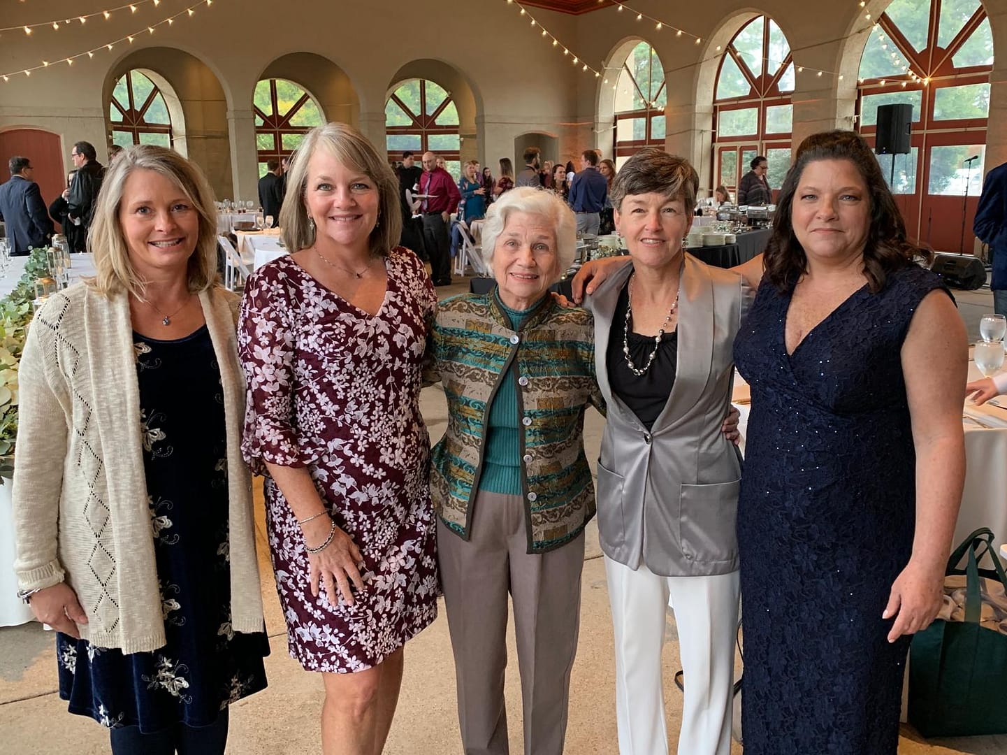 photo of Carolyn with her three daughters and daughter-in-law