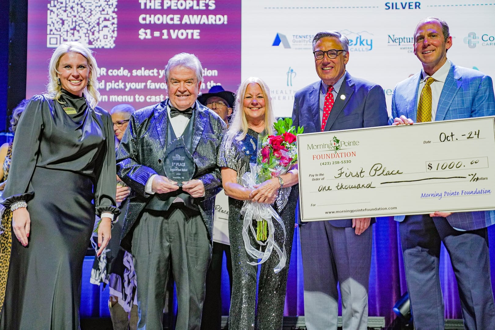 photo of the winners of the 2024 Morning Pointe Foundation Seniors Got Talent - Franklin show, left to right: Miranda Perez, Morning Pointe Foundation executive director; Jim Kirby and Judy Street, grand-prize winners; Greg A. Vital, Morning Pointe Senior Living president; and Franklin Farrow, Morning Pointe Senior Living CEO