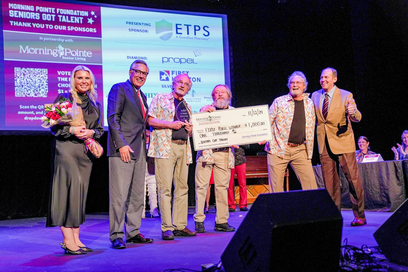 photo of, left to right: Miranda Perez, Morning Pointe Foundation executive director; Greg A. Vital, Morning Pointe Senior Living president and co-founder; Pistol Creek Catch of the Day, grand-prize winners; and Franklin Farrow, Morning Pointe Senior Living CEO and co-founder