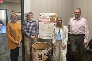 photo of Home Office staff with the Samaritan Center barrel