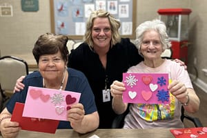 photo of Kristi Born from Hearth Hospice making sticker cards with residents at The Lantern at Morning Pointe of Chattanooga, TN