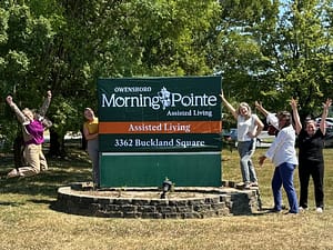 photo of Morning Pointe of Owensboro team by the sign