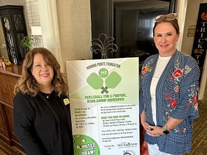 Photo of Traci Clements, executive director at Morning Pointe of Calhoun, and Leah Beamer, community relations director, with the pickleball poster