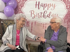 photo of June Wiley on her 103rd birthday with her friend Laura