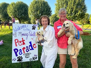 photo of resident Carol Papp with her daughter, Patty Belt, and grand-dogs: Bennie, a Maltese, and Annie, a Cocker Spaniel
